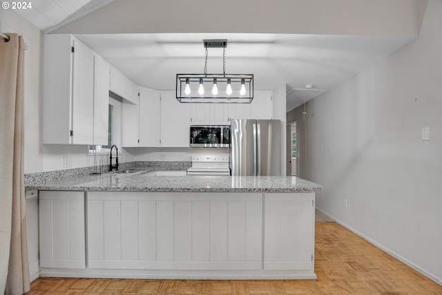 kitchen with white cabinetry, kitchen peninsula, sink, and appliances with stainless steel finishes