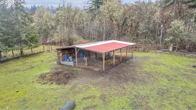 22715 SW Eagle Point Rd, Sheridan, OR 97378 - view of outdoor structure with a carport, a wooded view, an outbuilding, and an exterior structure