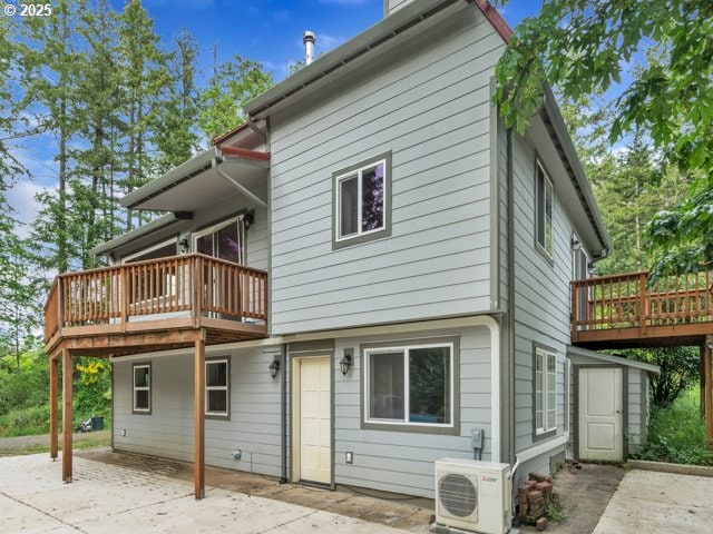 22715 SW Eagle Point Rd, Sheridan, OR 97378 - back of property with ac unit, a patio area, a wooden deck, and a storage shed