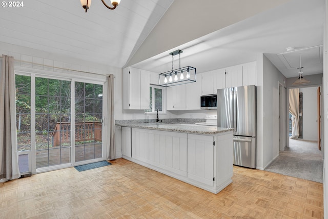 22715 SW Eagle Point Rd, Sheridan, OR 97378 - kitchen featuring appliances with stainless steel finishes, a peninsula, white cabinetry, lofted ceiling, and hanging light fixtures