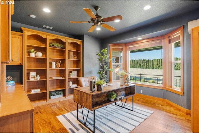 33138 SE Bluff Rd, Boring, OR 97009 - home office featuring light wood-style flooring, baseboards, a textured ceiling, a ceiling fan, and recessed lighting