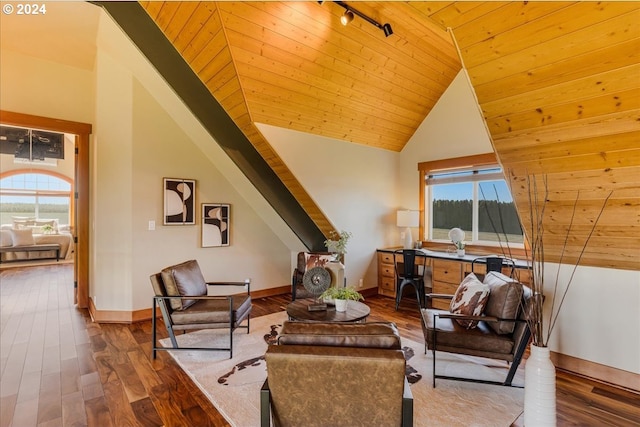 sitting room with hardwood / wood-style flooring, wooden ceiling, and vaulted ceiling