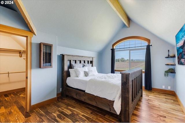 33138 SE Bluff Rd, Boring, OR 97009 - bedroom featuring wood finished floors, baseboards, a textured ceiling, and a closet