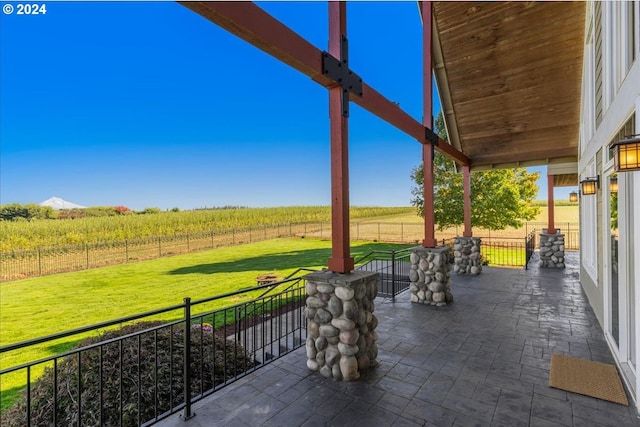 view of patio with a rural view