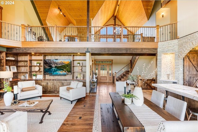 interior space featuring wood ceiling, wood-type flooring, beamed ceiling, and high vaulted ceiling