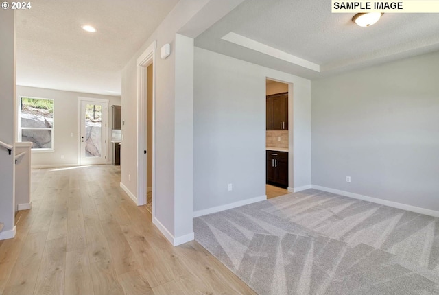 corridor featuring light hardwood / wood-style flooring