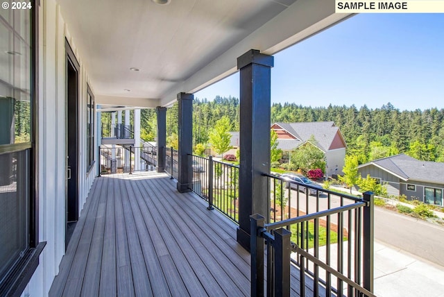 wooden terrace featuring a porch