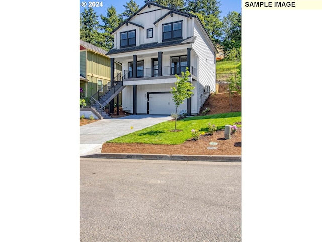 view of front of home with a porch, a garage, and a front lawn