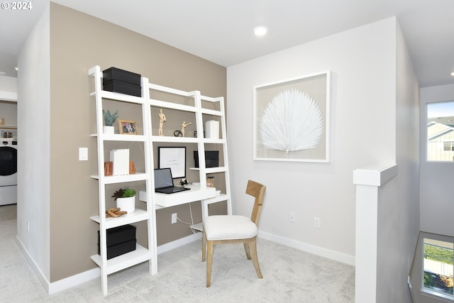 carpeted home office featuring a healthy amount of sunlight and washer / clothes dryer