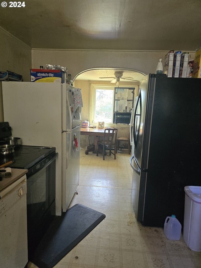 140 7th Ave, Sweet Home, OR 97386 - kitchen featuring freestanding refrigerator, arched walkways, light floors, black electric range oven, and ceiling fan