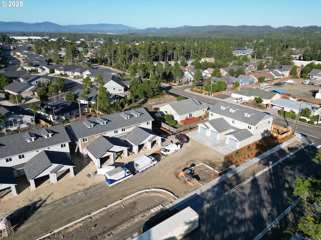 birds eye view of property with a mountain view and a residential view