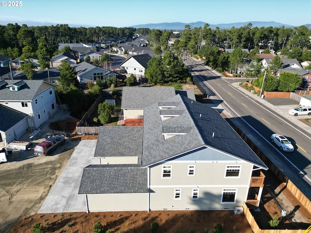 drone / aerial view with a residential view and a mountain view