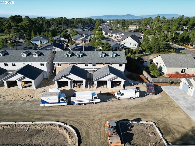 drone / aerial view with a residential view and a mountain view