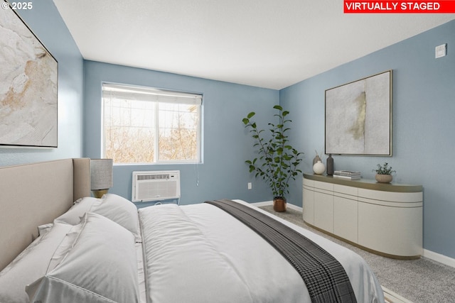 bedroom featuring a wall unit AC and carpet flooring