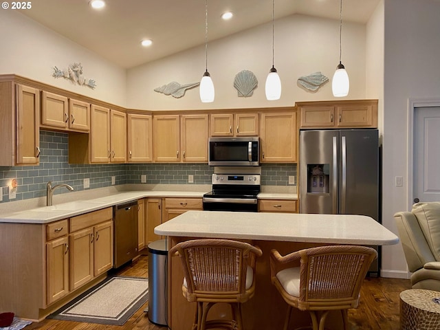 kitchen featuring stainless steel appliances, high vaulted ceiling, tasteful backsplash, and pendant lighting