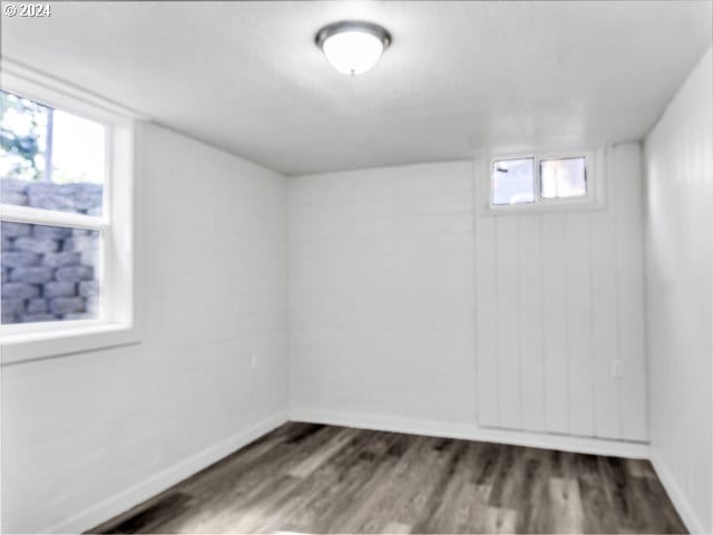 spare room featuring dark hardwood / wood-style floors