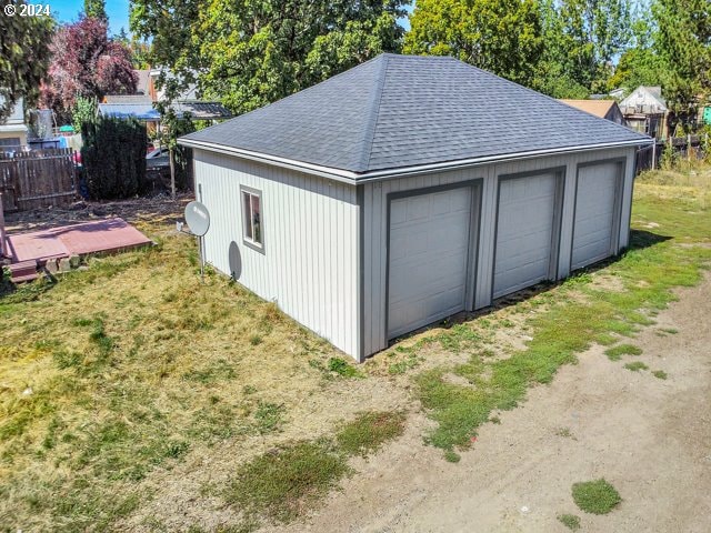 garage featuring a yard