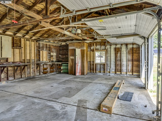 miscellaneous room with lofted ceiling