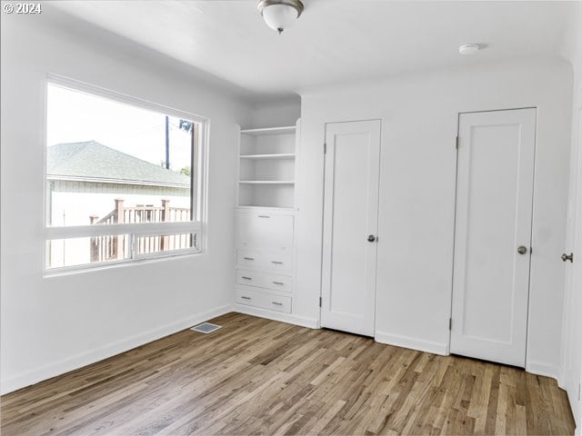 unfurnished bedroom featuring light hardwood / wood-style floors