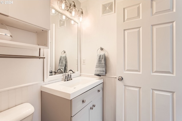 bathroom with vanity and toilet