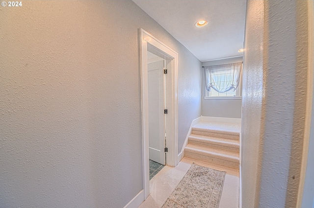 corridor with light tile patterned flooring