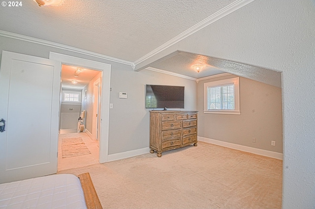 bedroom featuring a textured ceiling, light colored carpet, vaulted ceiling with beams, and crown molding