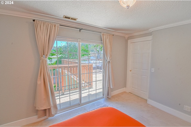 unfurnished bedroom featuring a textured ceiling, access to exterior, carpet flooring, and crown molding