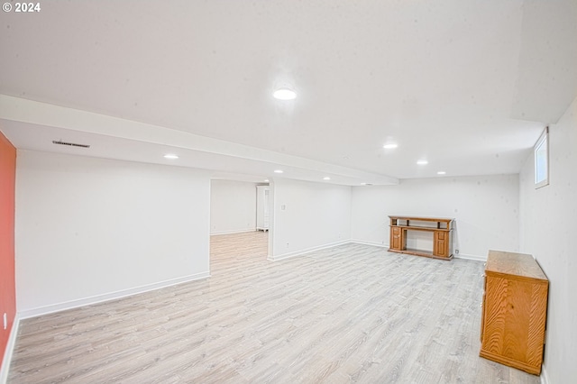 basement featuring light wood-type flooring