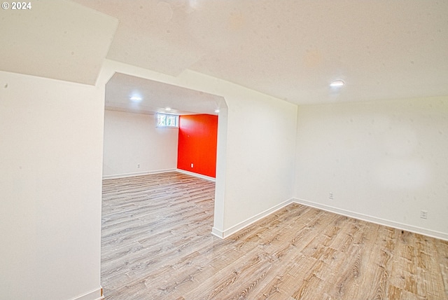 spare room featuring wood-type flooring