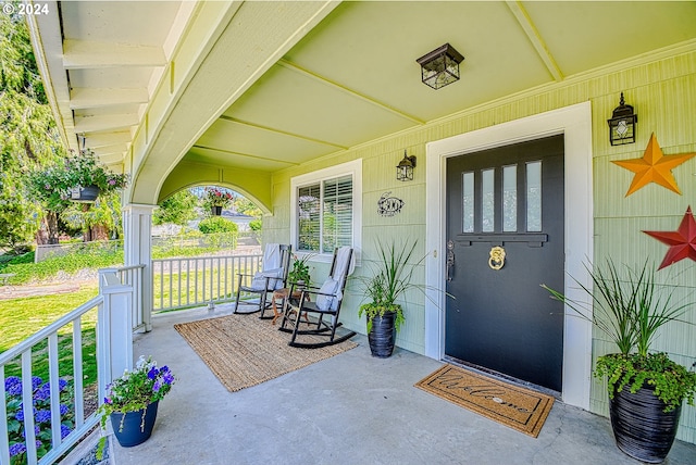 property entrance featuring covered porch