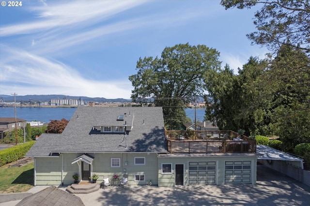 exterior space with a deck with water view