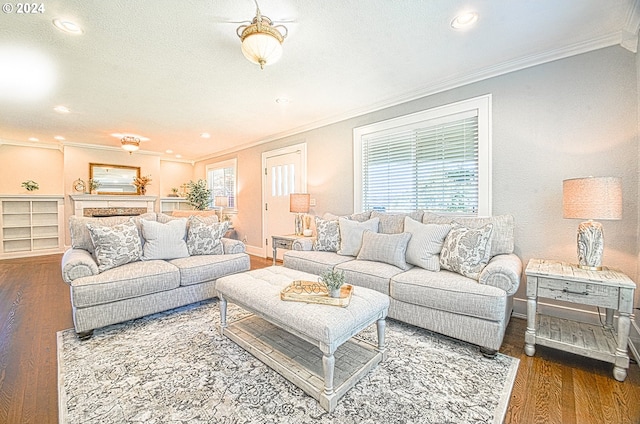 living room with ceiling fan, hardwood / wood-style flooring, and ornamental molding