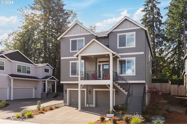 craftsman house with a garage and covered porch