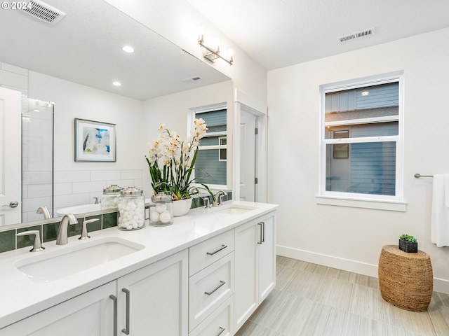 bathroom featuring vanity and a textured ceiling