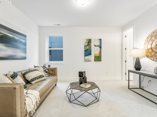 living room featuring light carpet