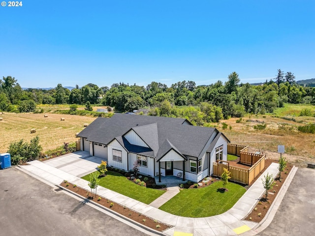 birds eye view of property with a rural view