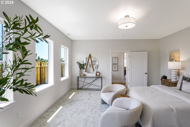 carpeted bedroom featuring connected bathroom