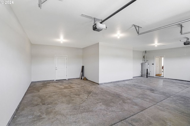 garage featuring a garage door opener and water heater