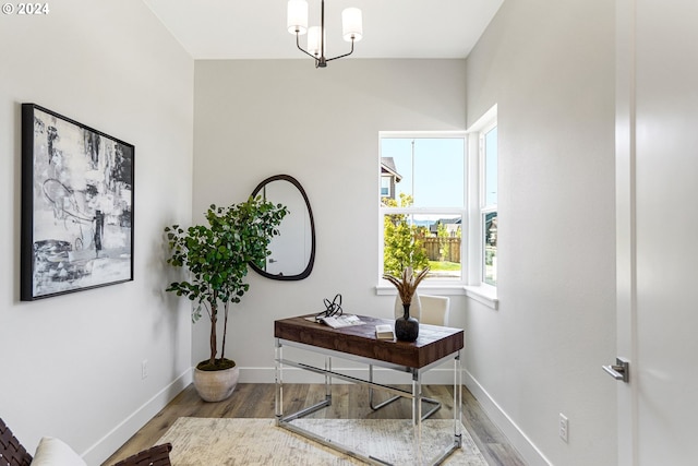 home office with a chandelier and wood-type flooring