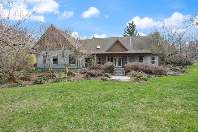 single story home featuring a front lawn