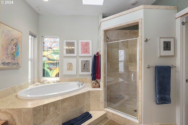 bathroom with tile floors and independent shower and bath