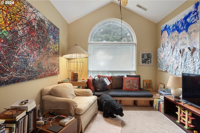 living room with lofted ceiling and carpet