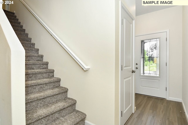 3915 SW Duniway Ln, Gresham, OR 97080 - foyer with stairs, wood finished floors, and baseboards