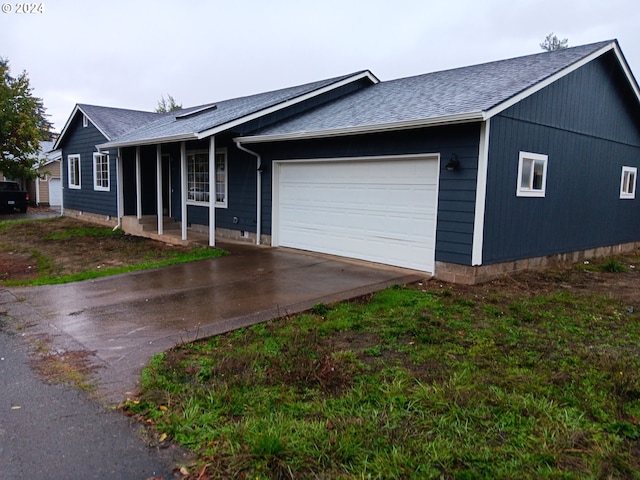 ranch-style home featuring a garage