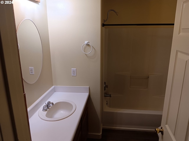 bathroom featuring vanity and shower / tub combination