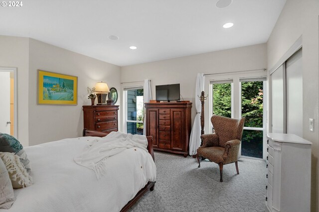 bedroom featuring light carpet, multiple windows, and recessed lighting