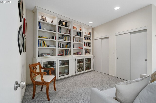 sitting room with light carpet and recessed lighting