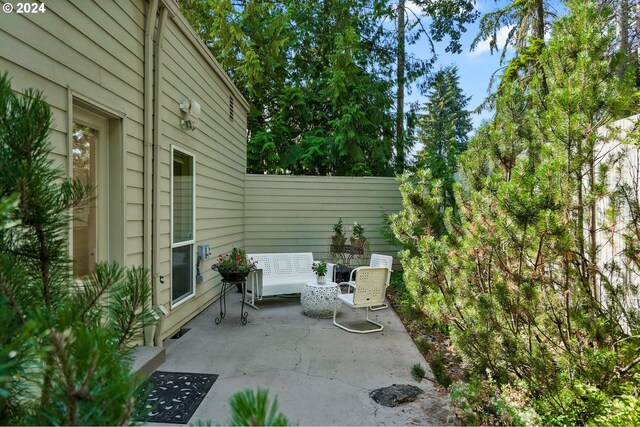 view of patio featuring fence