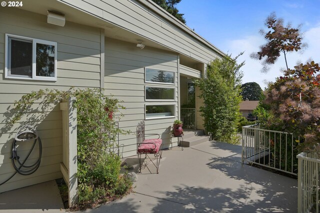 view of side of home featuring a patio