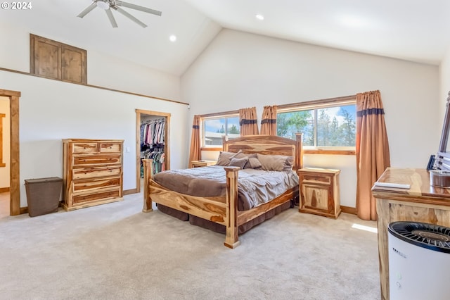 carpeted bedroom with a spacious closet, a closet, high vaulted ceiling, and ceiling fan